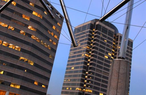 Triple Crown Sculpture with Buildings in Background