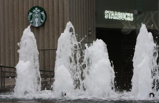 View of Starbucks Signage through fountain