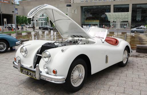 White Jaguar with open hood on Display on CC Square