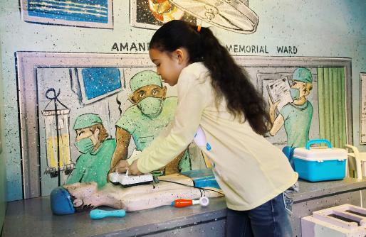 Young Girl playing as a doctor