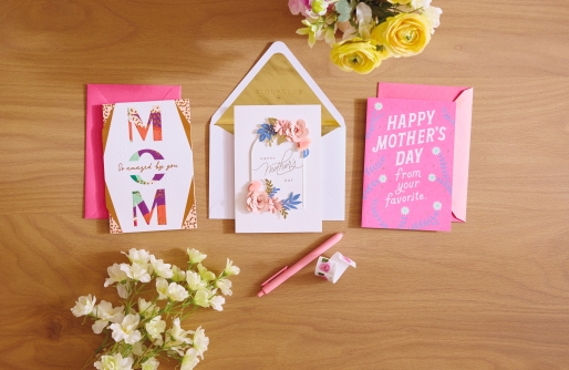 Three Mother's day cards on wooden tabletop