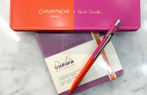 Orange and Purple Pen and Box and Purple Rhodia Notebook