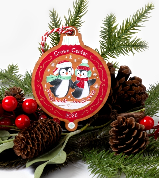 Penguins skating on Christmas ornament 
