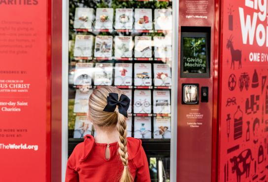 Girl in Front of GIving Machine