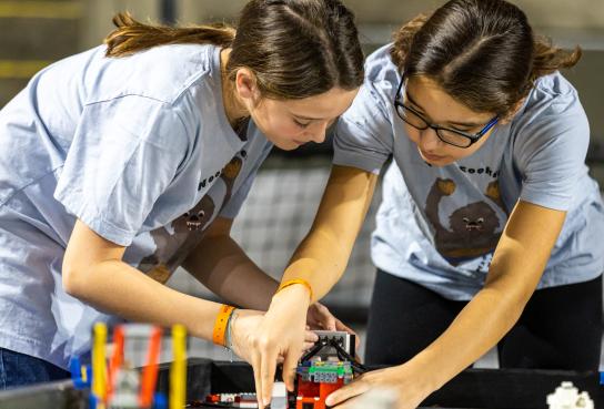 Two students working on robotics