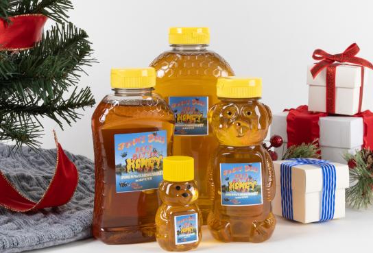 Various sized bottles of honey