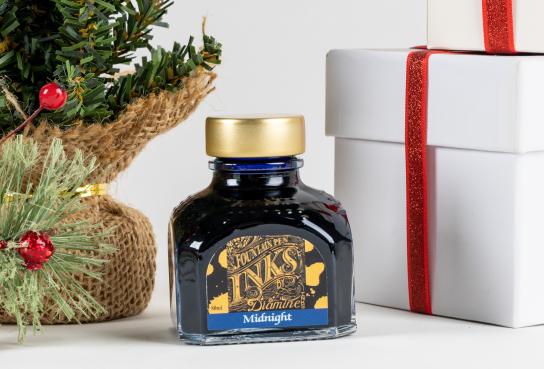 Ink Bottle next to Christmas Tree