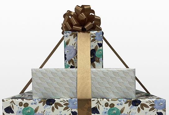 Stack of Gifts:  Floral paper, white paper, floral paper with brown ribbon