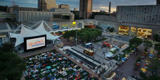 View of CC Square with Begin Screen and People