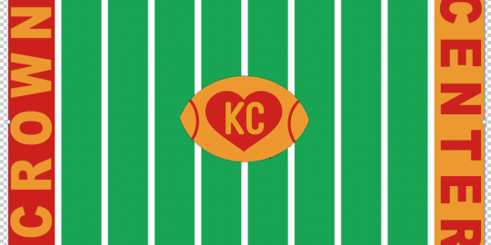 Green and white striped field, football with KC heart at center