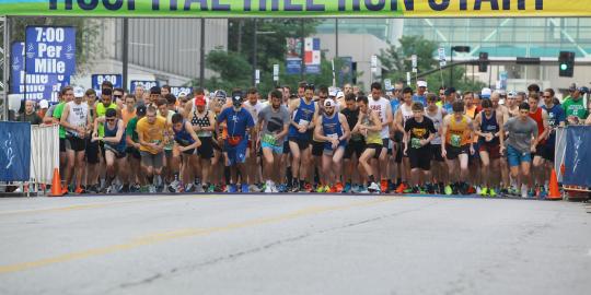 Runners prepared to go at the race start line 