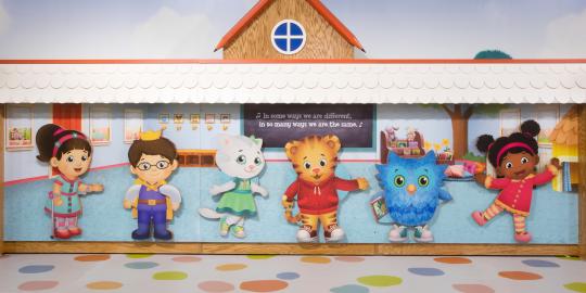 Small Characters from Daniel Tiger in front of building