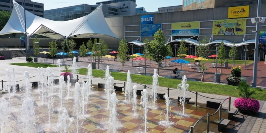 VIEW OF CROWN CENTER SQUARE WITH FOUNTAIN IN FRONT AND PAVILION, SEA LIFE AND LEGOLAND ENTRY IN BACKGRUOND